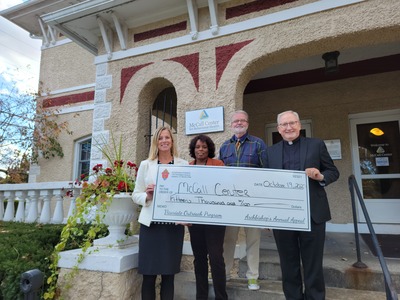 Father Kwiatkowski delivers a check for $15,000 to the McCall Center for Behavioral Health. McCall has been a long time recipient of grants from the Archbishop's Annual Appeal's Vicariate Outreach Program which assists local non-profit organizations continue the support that they give to our neighbors in need.