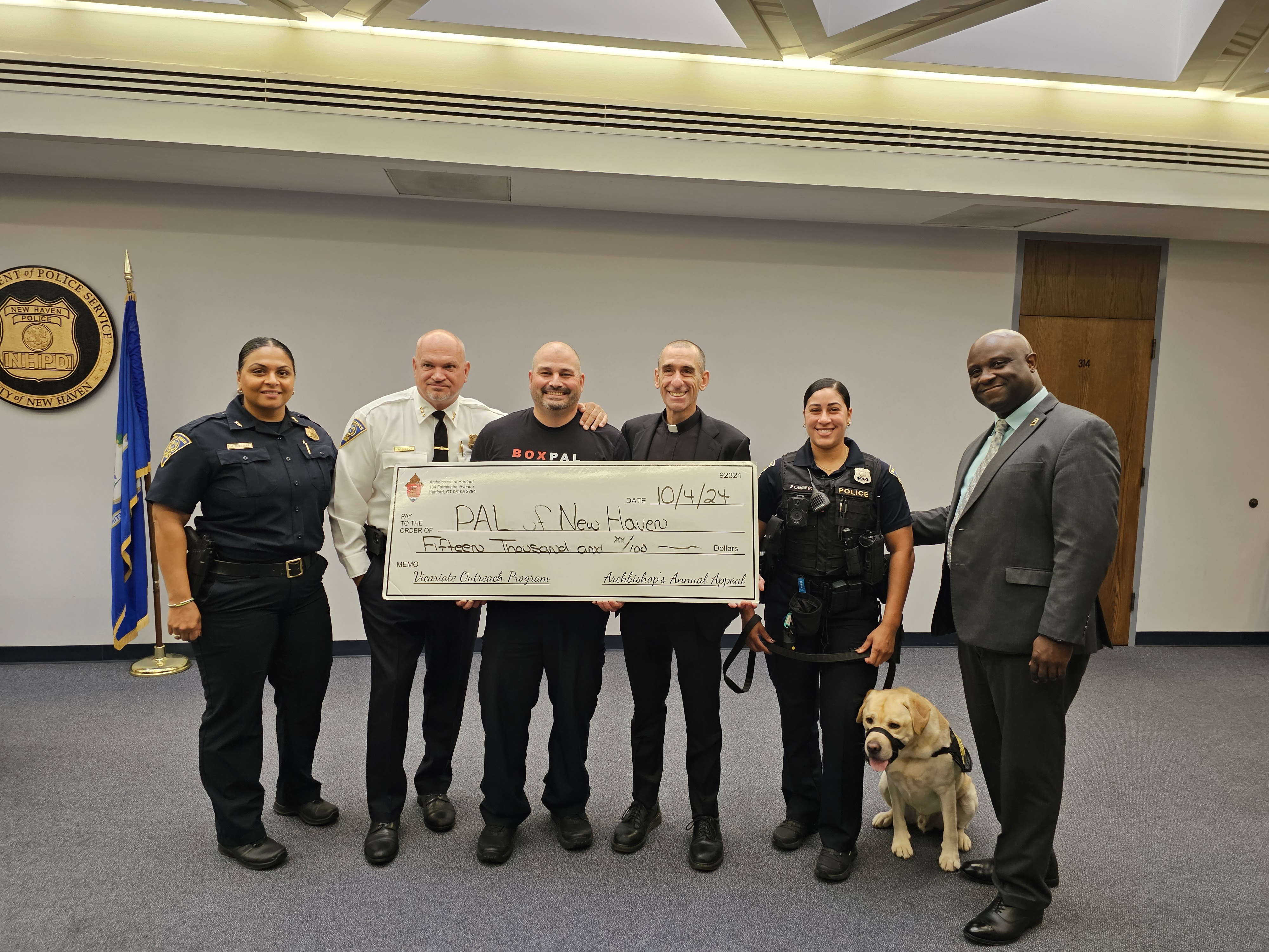 Father Lerner delivers a check for $15,000 to New Haven PAL. Police Activity League programs from cities throughout the Archdiocese have been long time recipient of grants from the Archbishop's Annual Appeal's Vicariate Outreach Program which assists local non-profit organizations continue the support that they give to our neighbors in need.